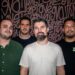Photo of a band posing for the camera