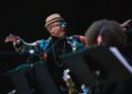 Photo of an orchestra conductor on stage