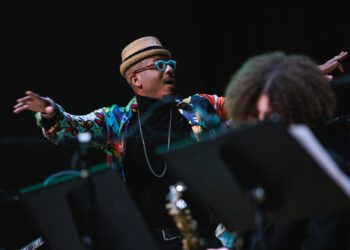 Photo of an orchestra conductor on stage