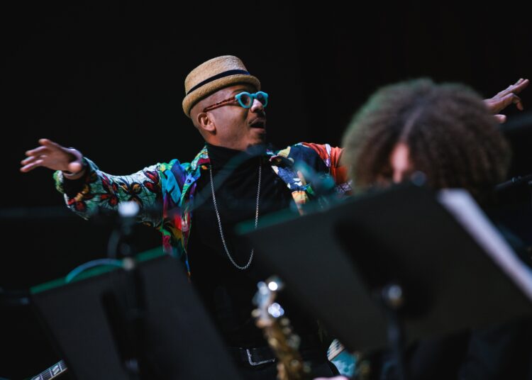 Photo of an orchestra conductor on stage