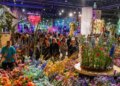 Visitors admiring a floral display at the 2025 Philadelphia Flower Show
