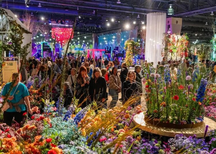 Visitors admiring a floral display at the 2025 Philadelphia Flower Show