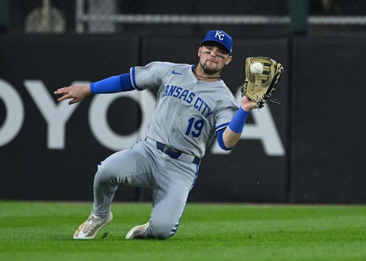Royals infielder Michael Massey makes a sliding catch during a game against the White Sox at Rate Field in Chicago on Aug. 27, 2025.