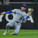 Royals infielder Michael Massey makes a sliding catch during a game against the White Sox at Rate Field in Chicago on Aug. 27, 2025.