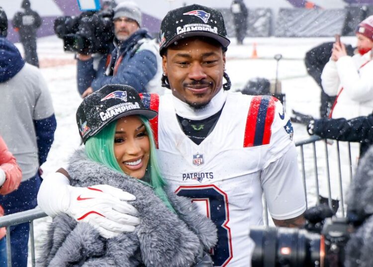 Cardi B and Stefon Diggs celebrate after the AFC Championship game against the Denver Broncos on Saturday, January 25, in Denver, Colorado.