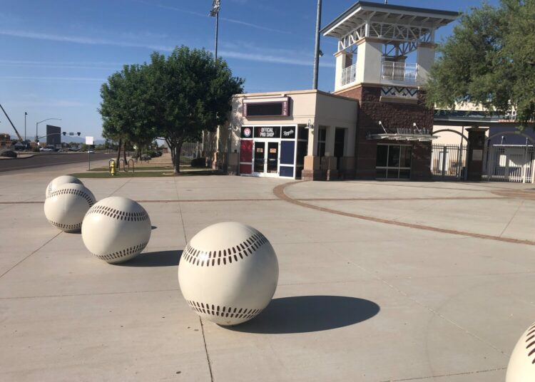 Decorative baseballs circle the entrance to Surprise Stadium.