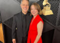A couple pausing for photos at the Grammy Awards