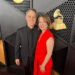 A couple pausing for photos at the Grammy Awards