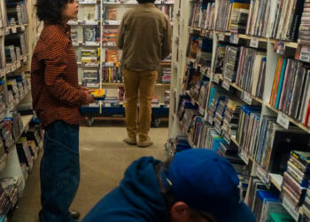 Vesta McDade, 13, browses DVDs at Videotheque in Highland Park.