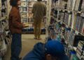 Vesta McDade, 13, browses DVDs at Videotheque in Highland Park.