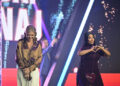 Erika Kirk, left, and Nicki Minaj stand on stage during Turning Point USA's AmericaFest 2025, Sunday, Dec. 21, 2025, in Phoenix. (AP Photo/Jon Cherry)