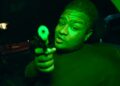 A Sydney rapper wanted over a gangland murder has surfaced in Bali, releasing a music video that openly mocks police while on the run.