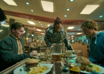 The Man From the Future, portrayed by Sam Rockwell, center, tries to persuade folks eating at a diner to join him on a dangerous endeavor in "Good Luck, Have Fun, Don't Die." (Courtesy of Briarcliff Entertainment)