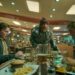 The Man From the Future, portrayed by Sam Rockwell, center, tries to persuade folks eating at a diner to join him on a dangerous endeavor in "Good Luck, Have Fun, Don't Die." (Courtesy of Briarcliff Entertainment)