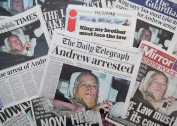 multiple british newspapers are displayed showing a front page image and accompanying story about andrew mountbatten windsor
