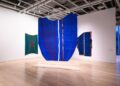 Art hangs in a museum.