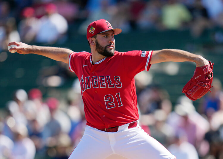 Angels starting pitcher Grayson Rodriguez throws to the plate during...