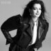Fashion editorial featuring a model in a black leather jacket and white tie.