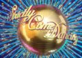 The logo for "Strictly Come Dancing" features a golden ball with sparkling effects, set against a vibrant blue background adorned with dynamic, radiating lines.