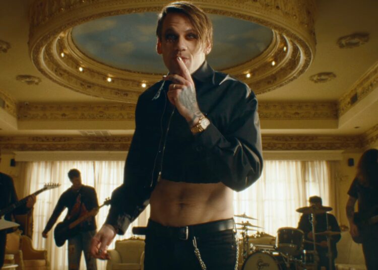 Caleb Shomo performing in the music video for Free by Beartooth.