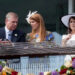 Andrew Mountbatten-Windsor, Princess Beatrice and Princess Eugenie attend the Derby Stakes at Epsom Racecourse in 2011. By: MEGA