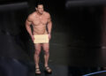 John Cena presents the award for best costume design during the Oscars on Sunday, March 10, 2024, at the Dolby Theatre in Los Angeles.