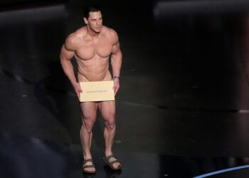John Cena presents the award for best costume design during the Oscars on Sunday, March 10, 2024, at the Dolby Theatre in Los Angeles.