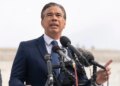 California Attorney General Rob Bonta speaking into several microphones.