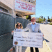 Maxine Littlejohn, business committee member for Santa Ynez Band of Chumash Indians, and Mark Herrier, executive director for the Lompoc Theatre Project, outside the Lompoc Theatre. (Courtesy photo)