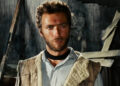 Clint Eastwood's Man with No Name stands in a dilapidated house in The Good, the Bad, and the Ugly