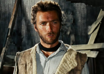 Clint Eastwood's Man with No Name stands in a dilapidated house in The Good, the Bad, and the Ugly