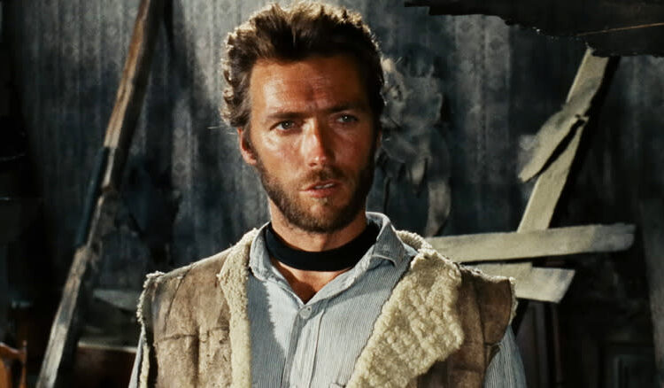 Clint Eastwood's Man with No Name stands in a dilapidated house in The Good, the Bad, and the Ugly