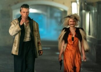 This image released by Warner Bros Entertainment shows Christian Bale, left, and Jessie Buckley in a scene from "The Bride!" (Warner Bros Entertainment via AP)