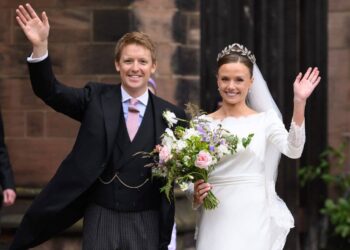 Hugh Grosvenor, Duke of Westminster and Olivia Grosvenor, Duchess of Westminster wave and smile to well-wishers after their wedding ceremony