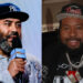 Ebro Darden with a beard, wearing a Yankees cap, holding a microphone, and Akademiks with a beard, wearing a Devils cap and chain.
