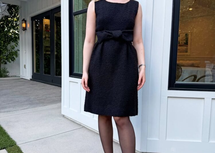 Elle Fanning Is So CBK-Coded in a '90s-Inspired Headband and a Vintage Balenciaga LBD with long blonde hair, sheer tights, and black patent pumps