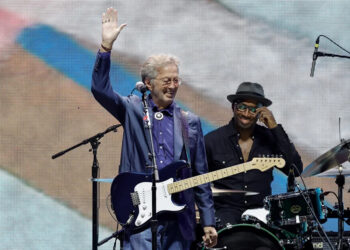 Eric Clapton waves to the fans during the Crossroads Guitar Festival at Crypto.com Arena on Sept. 24, 2023, in Los Angeles.