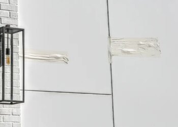Tape covers an area allegedly struck by bullets at the entrance to Rihanna's home in Beverly Hills, Calif.