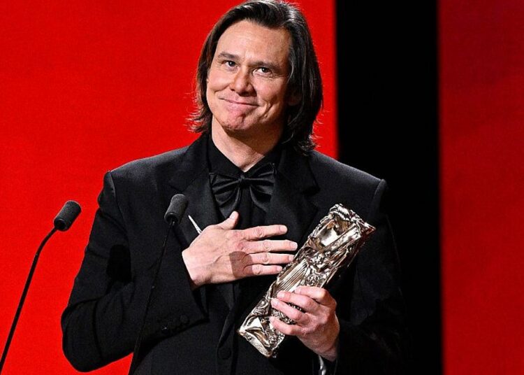 Jim Carrey accepts the Honorary César Award during the 51st César Film Awards