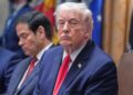 Trump listens in a meeting in January 2026