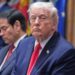 Trump listens in a meeting in January 2026