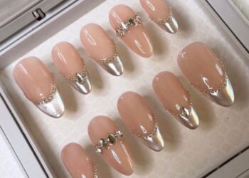 A set of cat eye French manicure nails