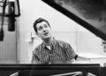 (Original Caption) 12/17/60: Singer Neil Sedaka seated at a piano.