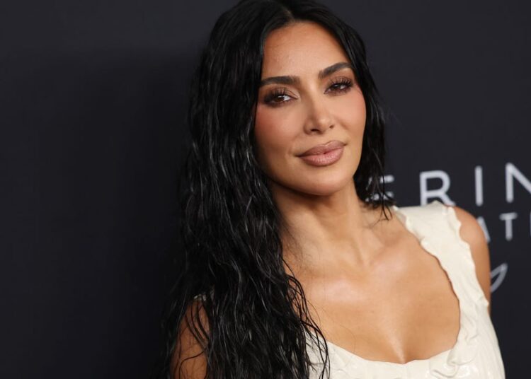 Kim Kardashian Channels Lewis Hamilton’s F1 Style in Japan
