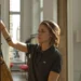 A young woman (Kristen Stewart) is shopping for clothes in the movie Personal Shopper.