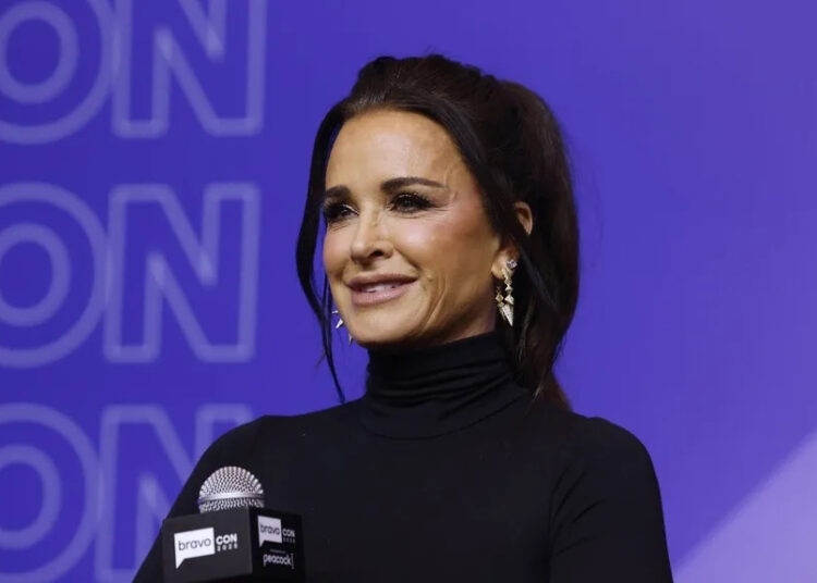 Kyle Richards smiles during a panel at BravoCon 2025.