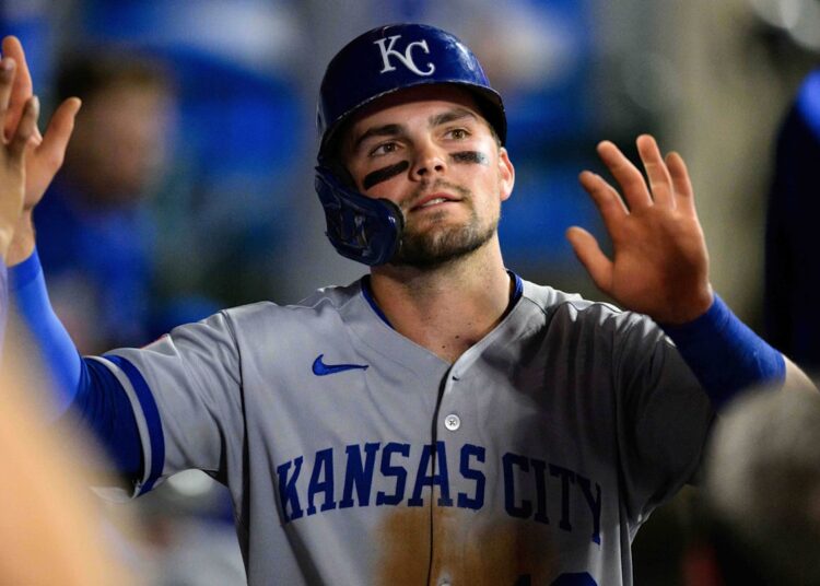 Sep 25, 2025; Anaheim, California, USA; Kansas City Royals second baseman Michael Massey (19) is greeted by teammates after scoring during the fifth inning against the Los Angeles Angels at Angel Stadium. Mandatory Credit: William Liang-Imagn Images