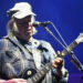 Neil Young performing at Glastonbury in 2025