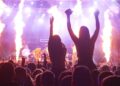 vibrant concert scene with crowd and fire effects