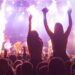 vibrant concert scene with crowd and fire effects